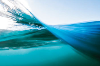 Wave shot showing space below and under the water surface