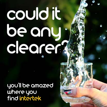 Clear water flowing into a glass