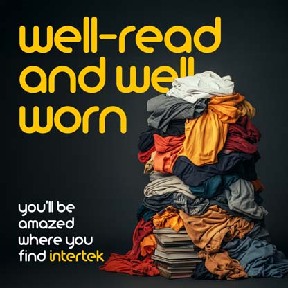 Pile of clothes sitting on a pile of books